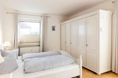 Ein Bett oder Betten in einem Zimmer der Unterkunft Ferienwohnung Austernfischer