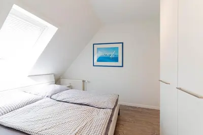 Ein Bett oder Betten in einem Zimmer der Unterkunft Ferienwohnung Ostseenest