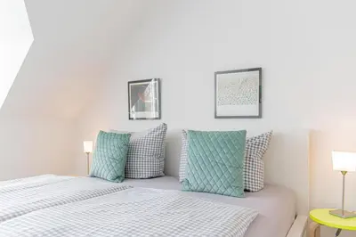 Ein Bett oder Betten in einem Zimmer der Unterkunft Ferienwohnung Der Olle Hansen