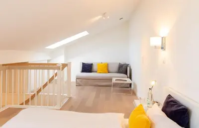 Ein Bett oder Betten in einem Zimmer der Unterkunft Ferienwohnung Maisonette Strandallee