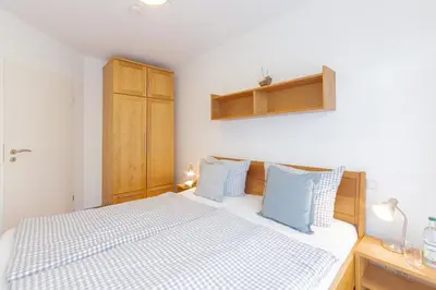 Ein Bett oder Betten in einem Zimmer der Unterkunft Ferienwohnung Strandroggen
