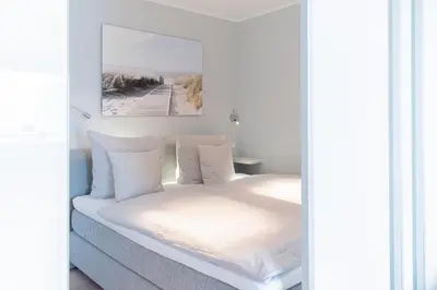 Ein Bett oder Betten in einem Zimmer der Unterkunft Ferienwohnung Meersehen