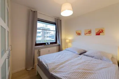 Ein Bett oder Betten in einem Zimmer der Unterkunft Ferienwohnung Muschel 2