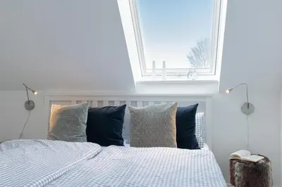Ein Bett oder Betten in einem Zimmer der Unterkunft Ferienwohnung Ostseeglitzern