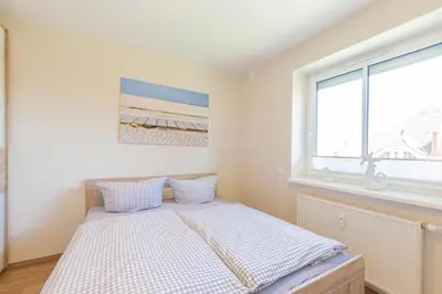 Ein Bett oder Betten in einem Zimmer der Unterkunft Ferienwohnung Morgensonne