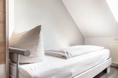 Ein Bett oder Betten in einem Zimmer der Unterkunft Ferienwohnung Ocean Drive