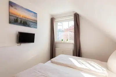 Ein Bett oder Betten in einem Zimmer der Unterkunft Ferienwohnung Ostseerauschen