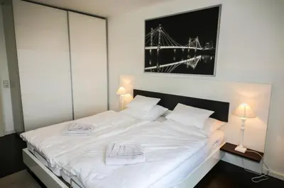 Ein Bett oder Betten in einem Zimmer der Unterkunft Ferienwohnung Residenz am Redderkrog