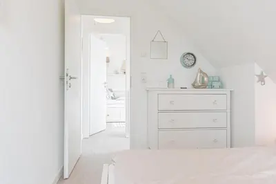 Ein Bett oder Betten in einem Zimmer der Unterkunft Ferienwohnung Sandbox