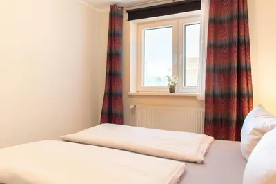 Ein Bett oder Betten in einem Zimmer der Unterkunft Ferienwohnung Seebrücke 04