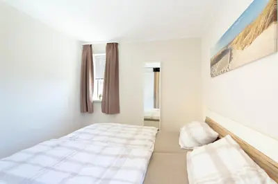 Ein Bett oder Betten in einem Zimmer der Unterkunft Ferienwohnung Seebrücke 09