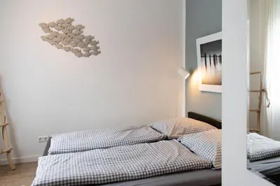 Ein Bett oder Betten in einem Zimmer der Unterkunft Ferienwohnung Strandlust