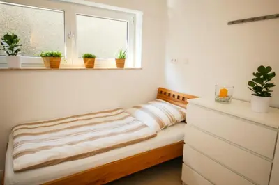 Ein Bett oder Betten in einem Zimmer der Unterkunft Ferienwohnung Strandhaus Möwenberg App. 77