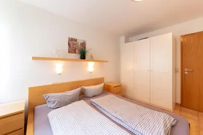 Ein Bett oder Betten in einem Zimmer der Unterkunft Ferienwohnung Strandperle