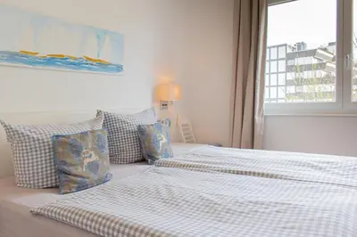 Ein Bett oder Betten in einem Zimmer der Unterkunft Ferienwohnung Stranddüne B 10