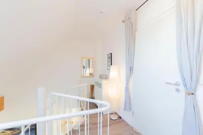 Ein Bett oder Betten in einem Zimmer der Unterkunft Ferienwohnung Residenz Barke App. 20