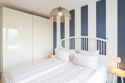 Ein Bett oder Betten in einem Zimmer der Unterkunft Ferienwohnung Strandvilla Augustusbad App. 18