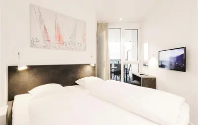 Ein Bett oder Betten in einem Zimmer der Unterkunft Highend Travemünde - Whg 302