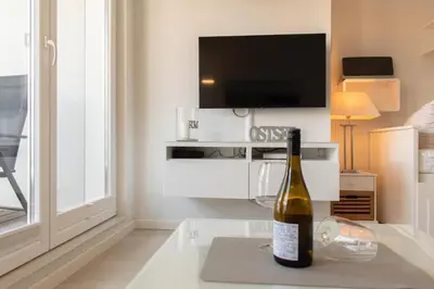 TV/Unterhaltungsangebot in der Unterkunft Ferienwohnung Sunshine Beachhouse 111