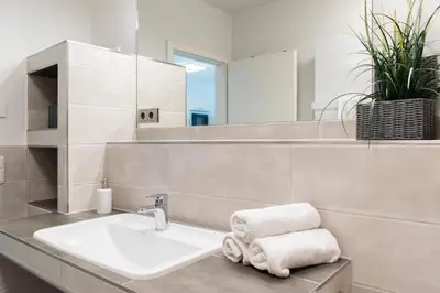 Ein Badezimmer in der Unterkunft Ferienwohnung Sunshine Beachhouse 111