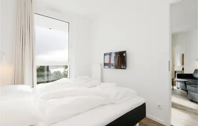 Ein Bett oder Betten in einem Zimmer der Unterkunft Highend Travemünde - Whg 506