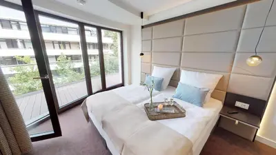 Ein Bett oder Betten in einem Zimmer der Unterkunft White Pearl Apartment 2.16