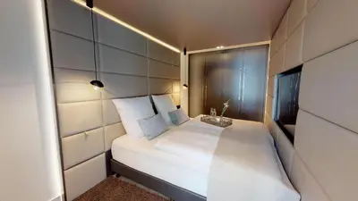 Ein Bett oder Betten in einem Zimmer der Unterkunft White Pearl Apartment 1.09
