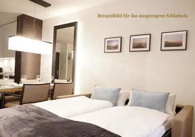 Ein Bett oder Betten in einem Zimmer der Unterkunft White Pearl Apartment 0.13