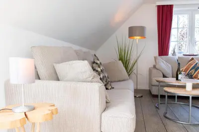 Ein Sitzbereich in der Unterkunft Ferienwohnung Viermaster