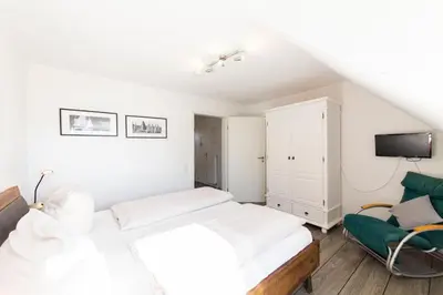 Ein Bett oder Betten in einem Zimmer der Unterkunft Ferienwohnung Viermaster