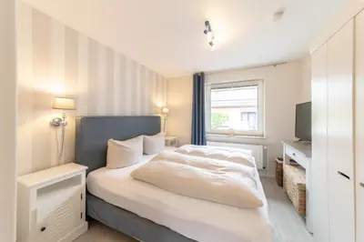 Ein Bett oder Betten in einem Zimmer der Unterkunft Ferienwohnung Hansa Lounge 20a