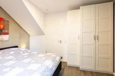 Ein Bett oder Betten in einem Zimmer der Unterkunft Ferienwohnung Hafenkante