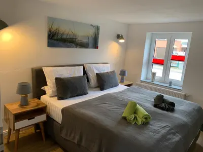 Ein Bett oder Betten in einem Zimmer der Unterkunft FeWo No.18
