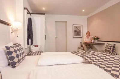 Ein Bett oder Betten in einem Zimmer der Unterkunft Strandgrün Golf- & Spa Resort