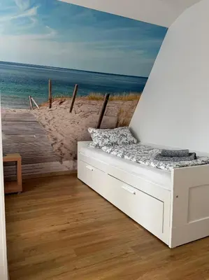 Ein Bett oder Betten in einem Zimmer der Unterkunft Ferienwohnung Baltic Living