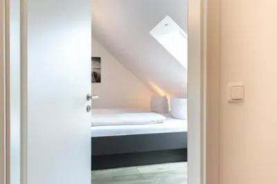 Ein Bett oder Betten in einem Zimmer der Unterkunft Ferienwohnung Windstärke 9