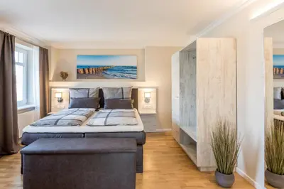 Ein Bett oder Betten in einem Zimmer der Unterkunft Nordic Wave Apartments