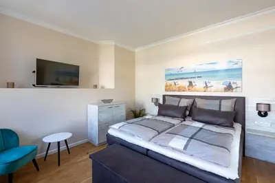 Ein Bett oder Betten in einem Zimmer der Unterkunft Nordic Wave Apartments