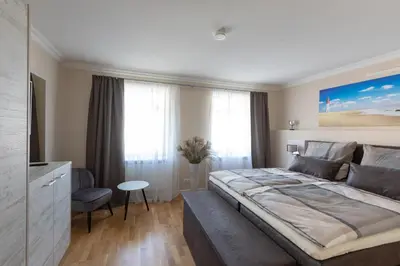 Ein Bett oder Betten in einem Zimmer der Unterkunft Nordic Wave Apartments
