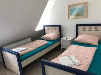 Ein Bett oder Betten in einem Zimmer der Unterkunft Pension Adler