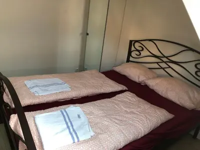 Ein Bett oder Betten in einem Zimmer der Unterkunft Pension Adler