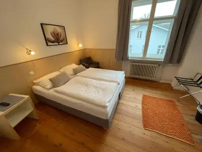Ein Bett oder Betten in einem Zimmer der Unterkunft ApartHotel Stadtpark