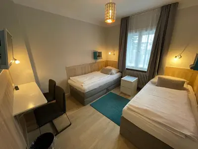 Ein Bett oder Betten in einem Zimmer der Unterkunft ApartHotel Stadtpark