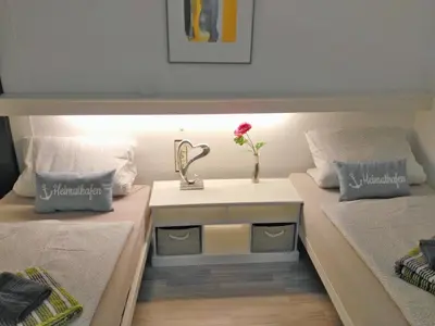Ein Bett oder Betten in einem Zimmer der Unterkunft Ferienpark Sierksdorf Nautilus Panorama-Meerblick