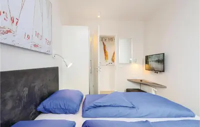 Ein Bett oder Betten in einem Zimmer der Unterkunft Passatvilla - Apartment 7