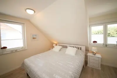 Ein Bett oder Betten in einem Zimmer der Unterkunft Ferienwohnung Min to Huus