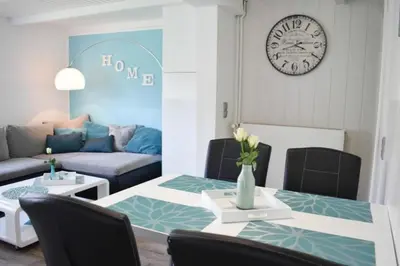 Ein Sitzbereich in der Unterkunft Ferienhaus Dünenhaus