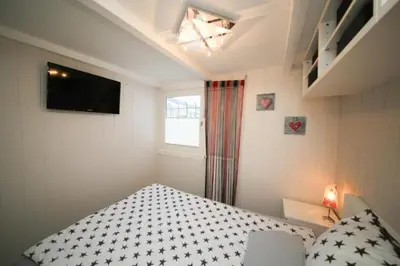 Ein Bett oder Betten in einem Zimmer der Unterkunft Ferienhaus Dünenhaus
