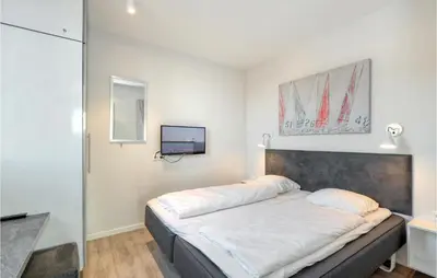 Ein Bett oder Betten in einem Zimmer der Unterkunft Passatvilla - Apartment 3