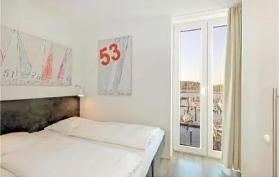 Ein Bett oder Betten in einem Zimmer der Unterkunft Passatvilla - Apartment 5